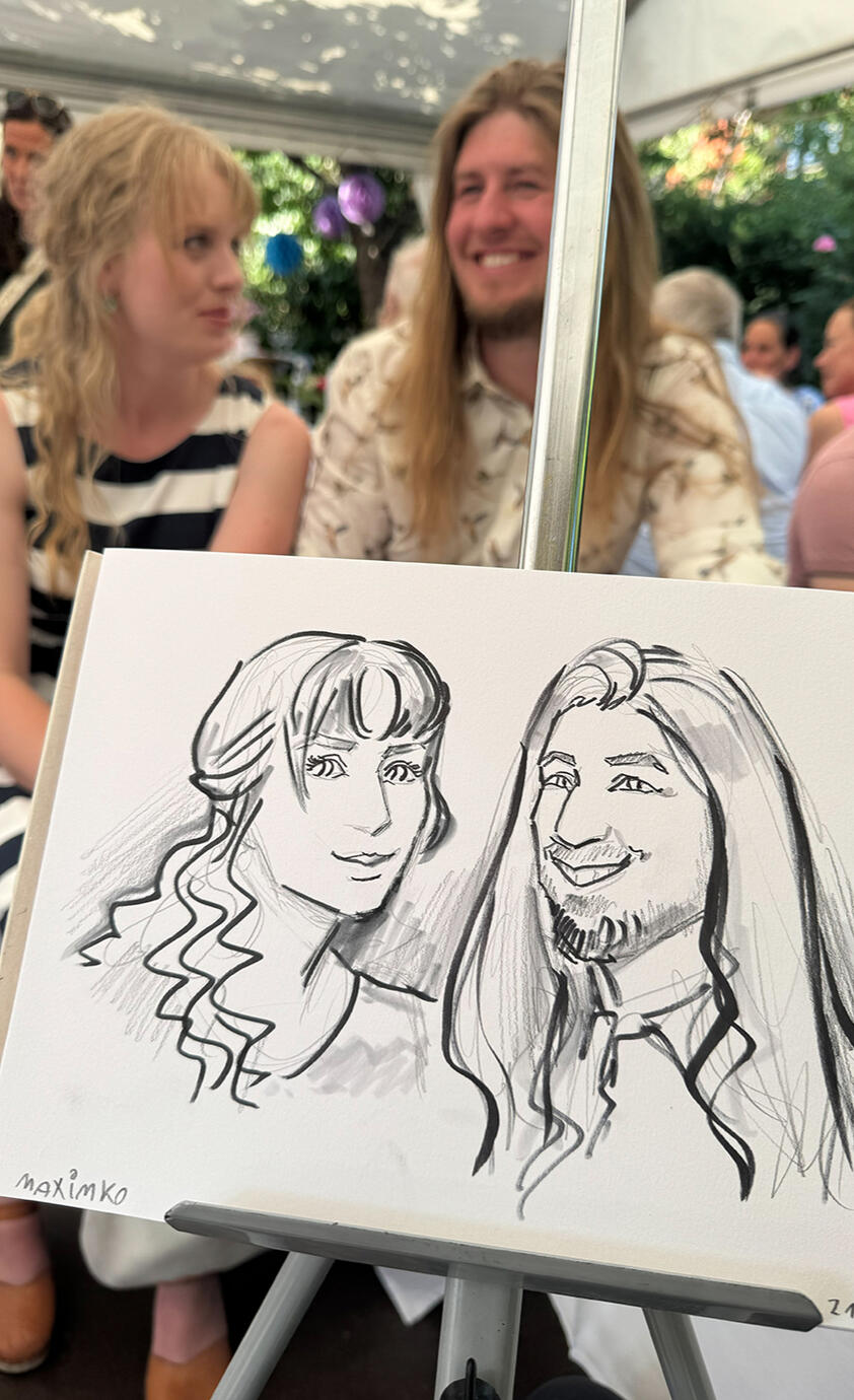 Live portraits and caricatures at a wedding happy customers